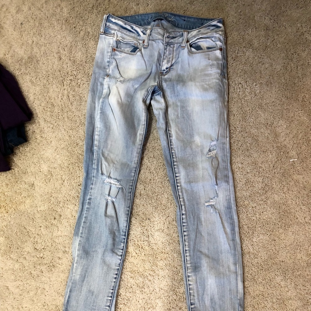 Light wash jeans with rips
